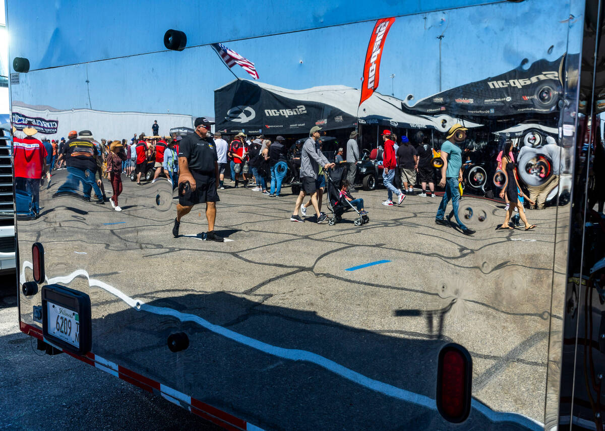 Fans are selected in a chrome trailer in the pits during Day 2 of NHRA Nationals at the Las Veg ...