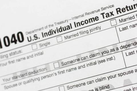 A portion of the 1040 U.S. Individual Income Tax Return form is shown July 24, 2018, in New Yor ...