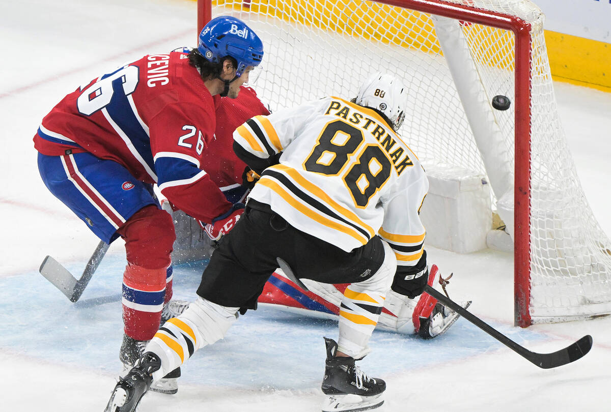 Boston Bruins' David Pastrnak (88) scores as Montreal Canadiens' Johnathan Kovacevic defends du ...