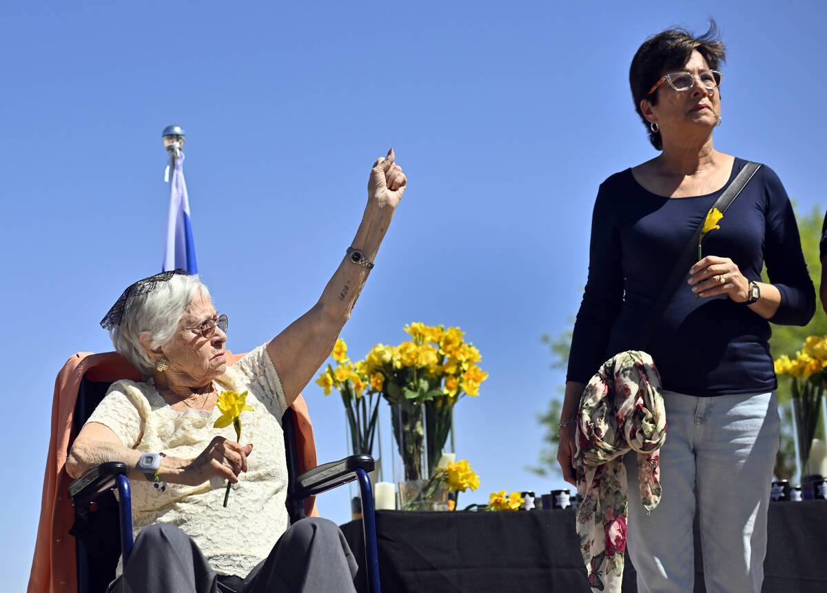 Holocaust survivor Lucy Jacobs, left, of Las Vegas displays her tattoo that she received as a t ...