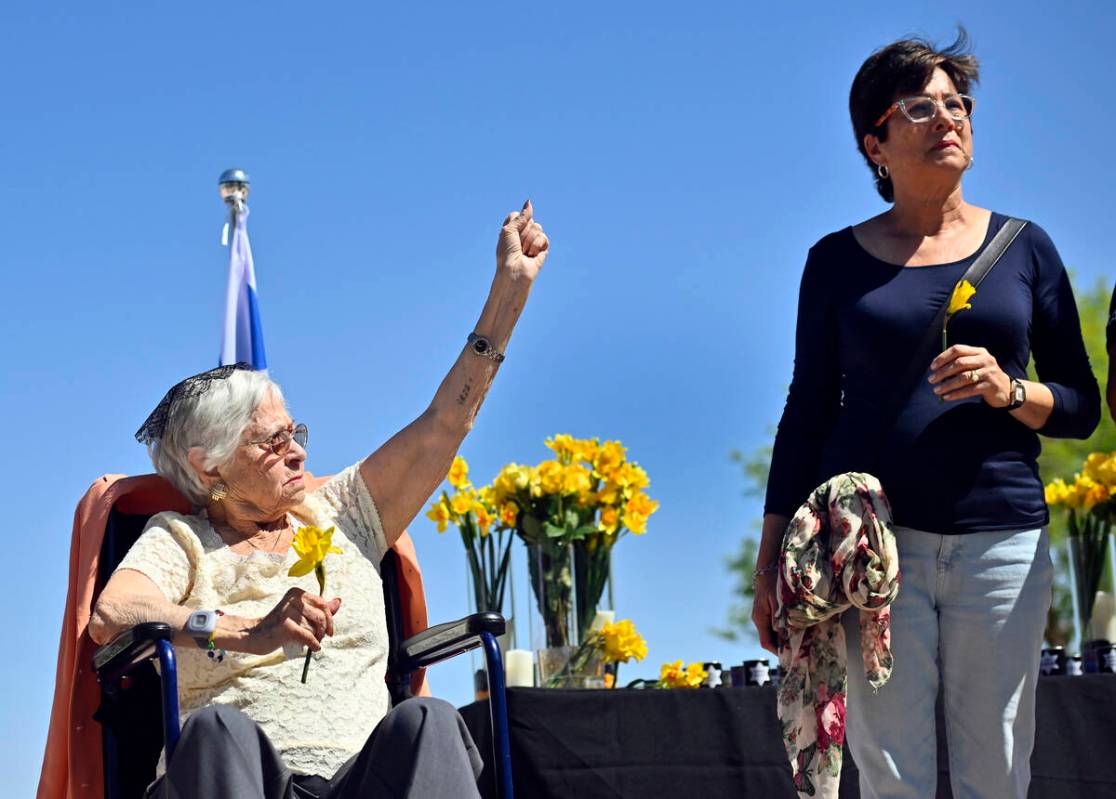 Holocaust survivor Lucy Jacobs, left, of Las Vegas displays her tattoo that she received as a t ...