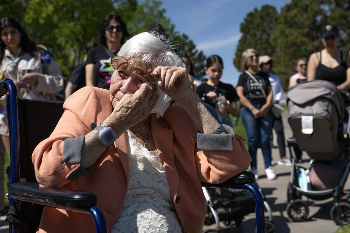 Holocaust survivor Lucy Jacobs, wipes a tear during the Six Million Steps gathering at The Hill ...