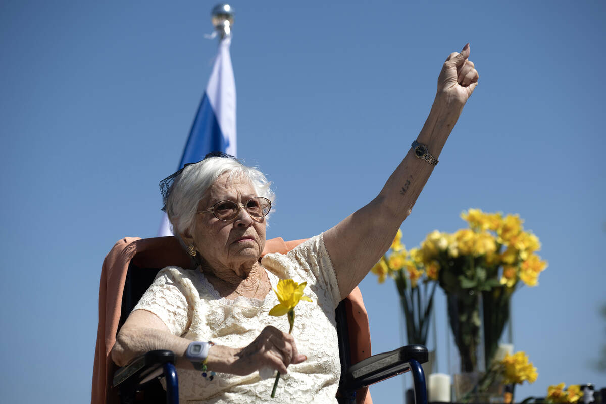 Holocaust survivor Lucy Jacobs, left, of Las Vegas displays her tattoo that she received as a t ...