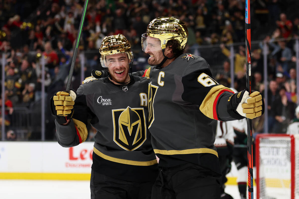 Vegas Golden Knights right wing Mark Stone (61) celebrates his goal with right wing Reilly Smit ...