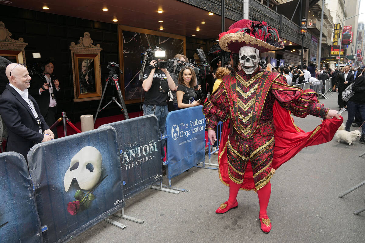 A costumed ticket holder attends "The Phantom of the Opera," final Broadway performan ...