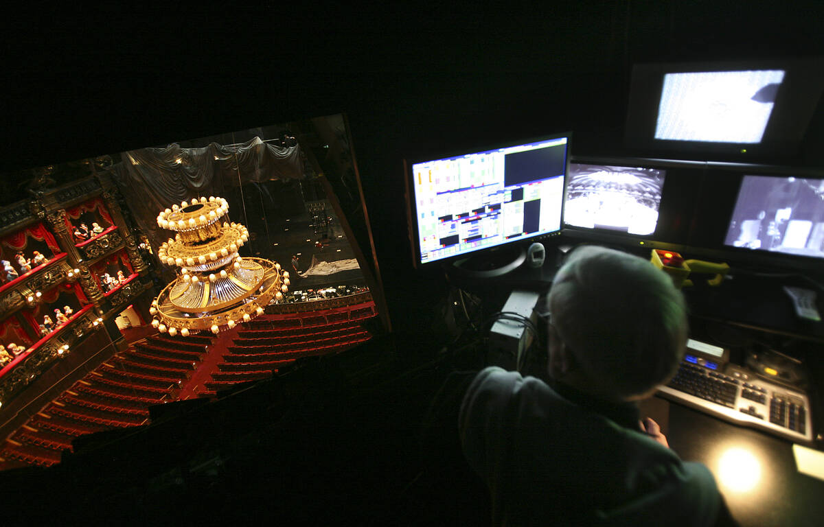 Head of automation William Stephenson controls the chandelier in the Phantom Theater at the Ven ...