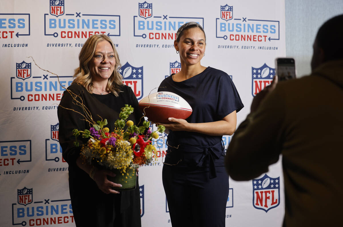 Any Occasion Baskets founder Felicia Parker, right, and florist Sterling Connell, left, pose fo ...