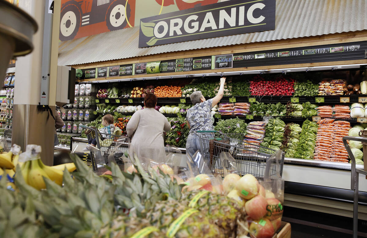 Customers shop on the opening day of Sprouts Farmers Market at 8441 Farm Road, in Las Vegas in ...