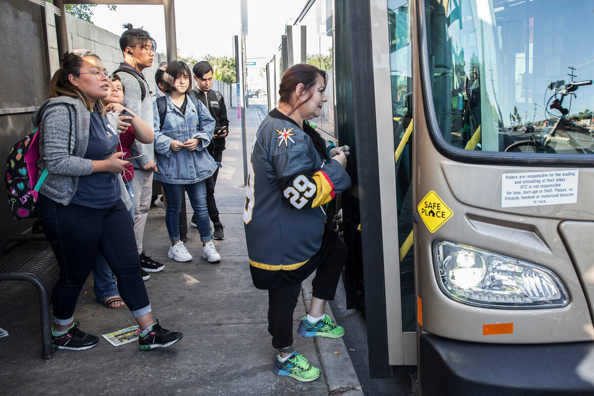 Elena Leger, right, boards an RTC bus to take her to Toshiba Plaza to watch the Vegas Golden Kn ...