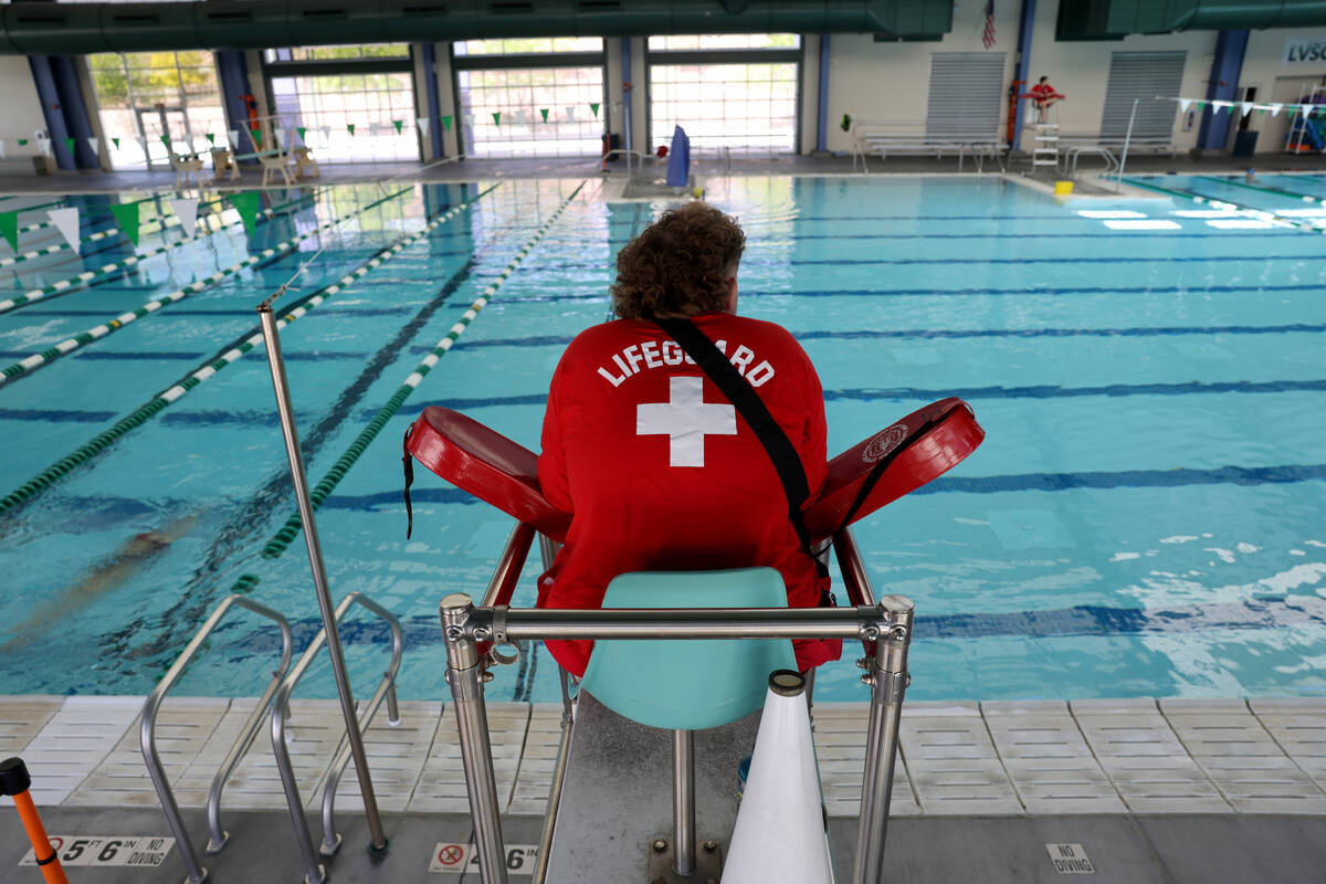 Lifeguard Caleb Staats, 18, watches swimmers at Pavilion Center Pool in Las Vegas Tuesday, Apri ...
