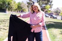 Ellie Thomas poses for a photo with one of the pants she wore at the height of her 315 pounds w ...