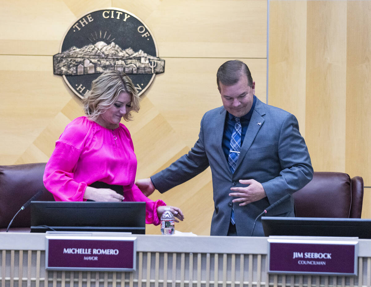Henderson Mayor Michelle Romero welcomes Jim Seebock as he takes his seat after being sworn in ...