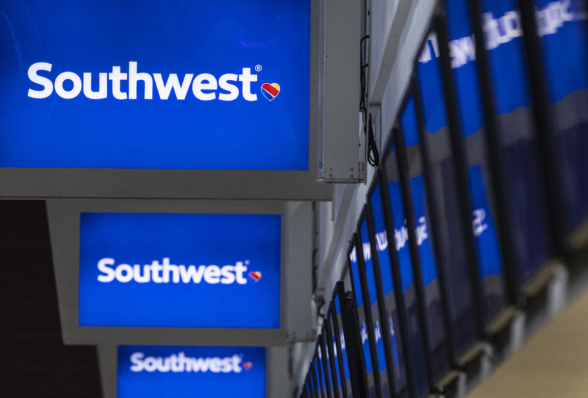 The Southwest Airlines signs are shown at Terminal 1 of Harry Reid International Airport, on Fr ...