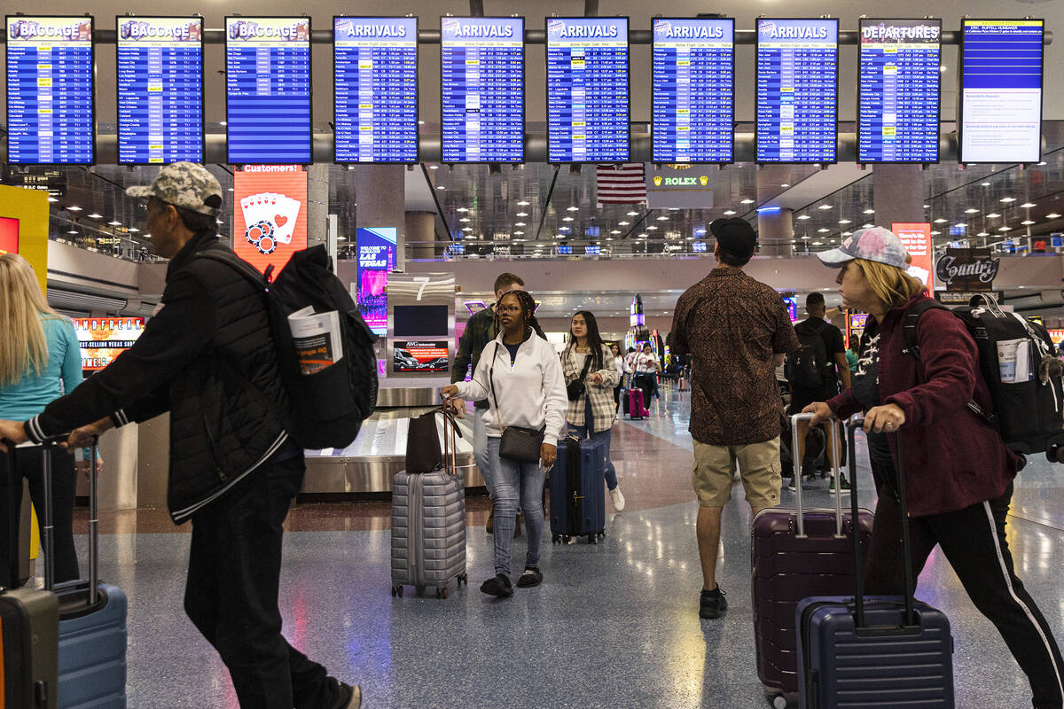 Passengers arrive in Terminal 1 of Harry Reid International Airport, on Friday, April 21, 2023, ...