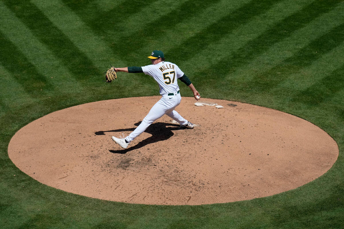 Oakland Athletics pitcher Mason Miller throws against the Chicago Cubs during the fourth inning ...