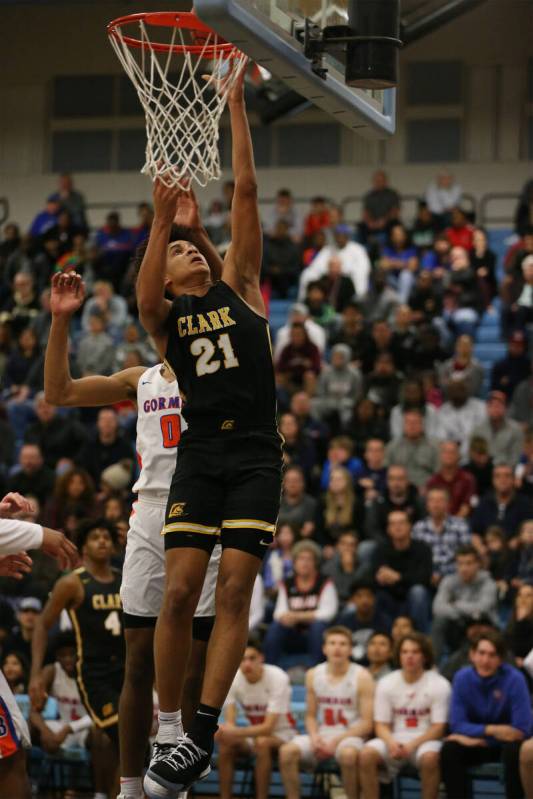 Clark's Jalen Hill (21) goes up for a shot against Bishop Gorman in the Desert Region boys bask ...