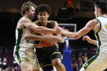 Clark's Jalen Hill (21) protects the ball from Bishop Manogue's Brayden Debruin (0) and Kolton ...