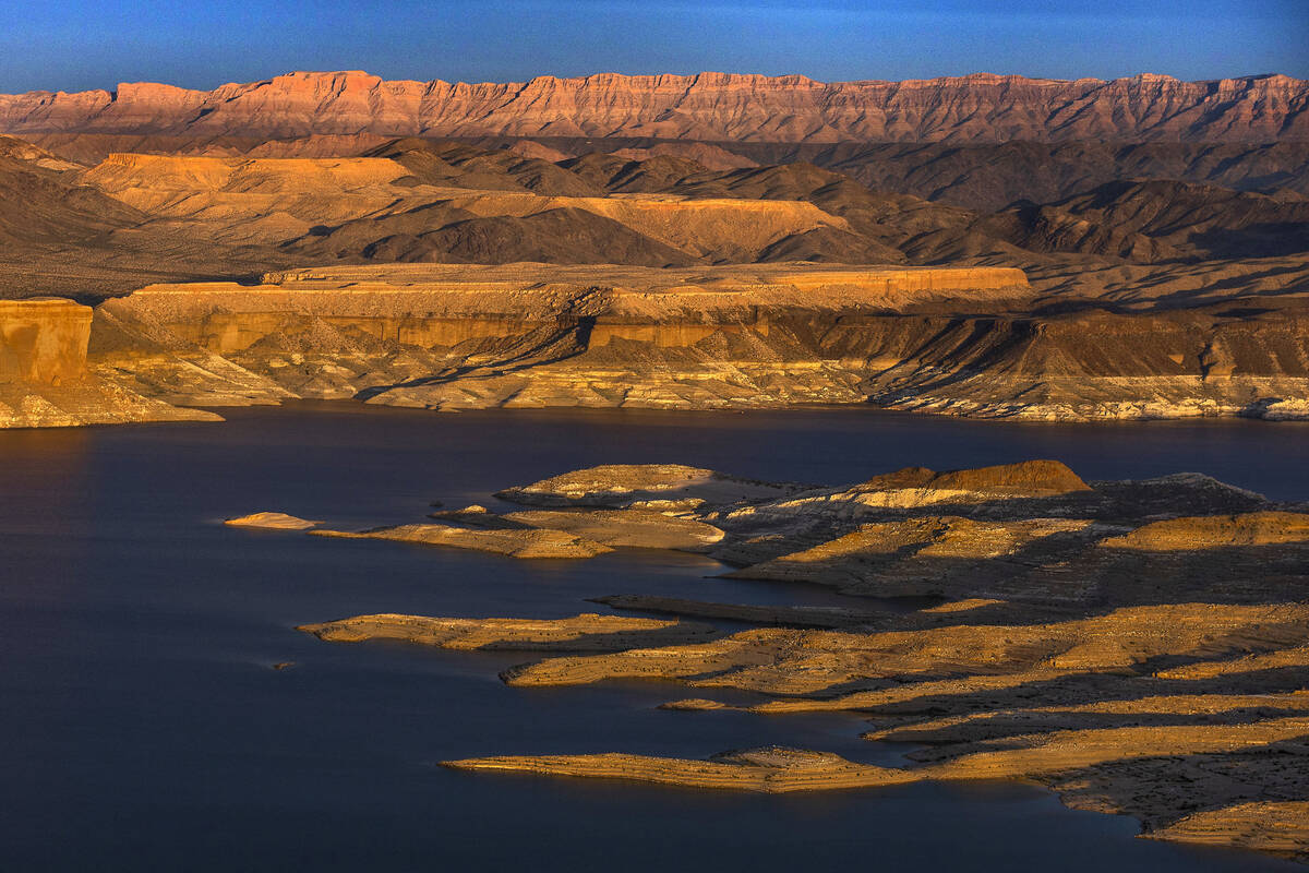 The sun sets on Temple Bar about the receding Lake Mead shoreline on Monday, March. 6, 2023, in ...