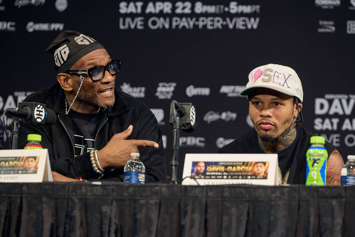 Gervonta Davis (right) sits beside trainer Calvin Ford during the final promotional press confe ...