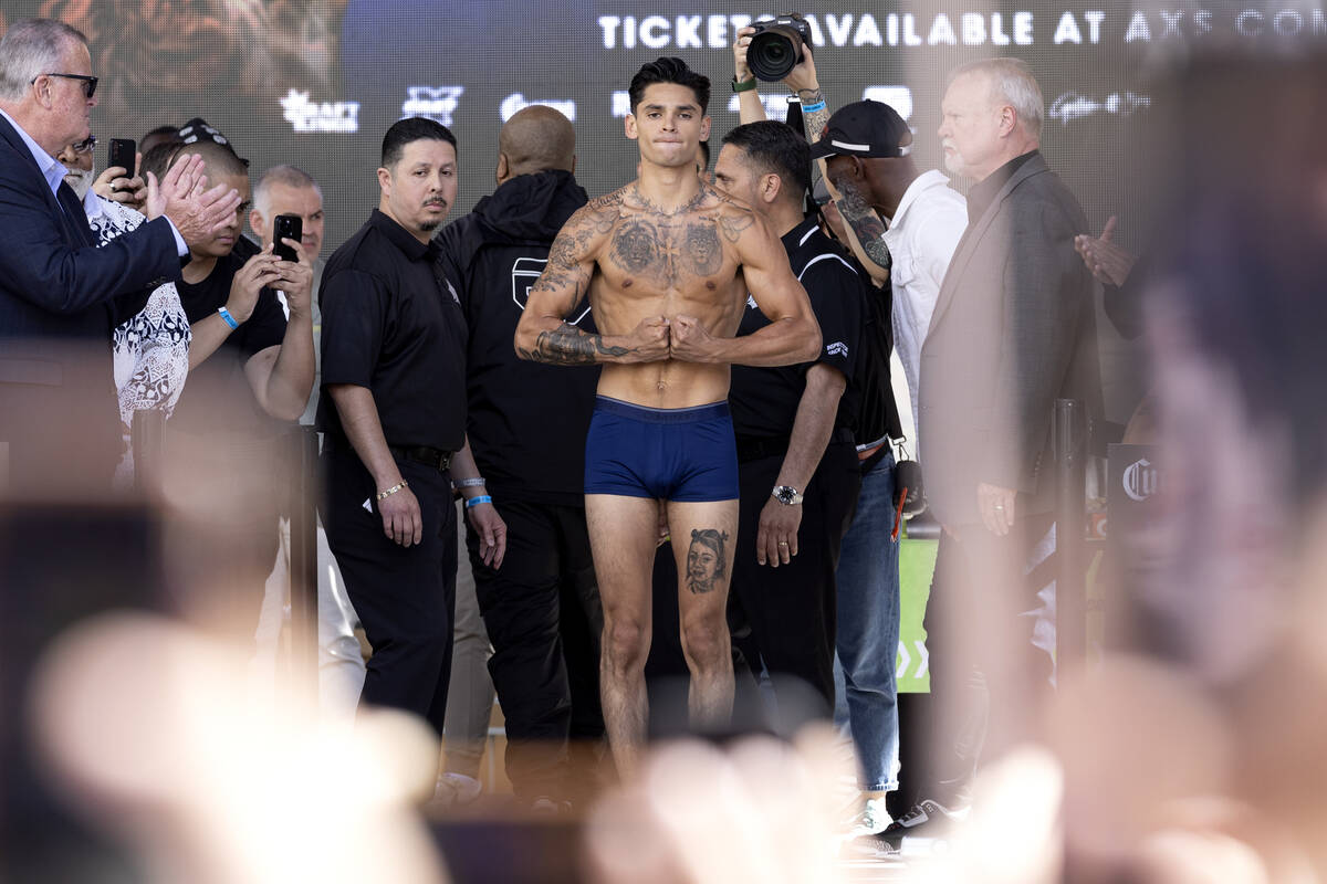 Ryan Garcia flexes during a weigh-in at Toshiba Plaza on Friday, April 21, 2023, in Las Vegas. ...