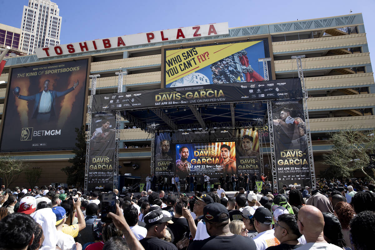 Fans gather to watch weigh-ins ahead of the Davis vs. Garcia fight at Toshiba Plaza on Friday, ...