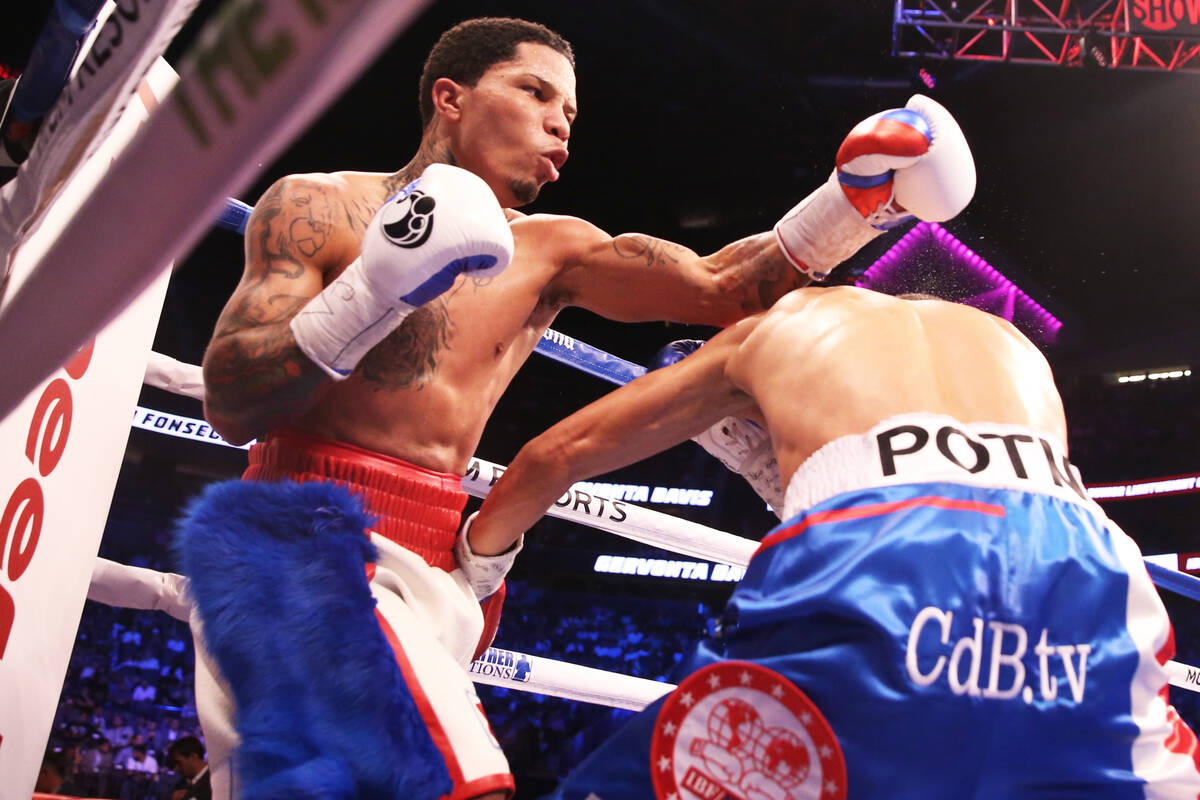 Gervonta Davis, left, throws a punch against Francisco Fonseca in the 7th round on Saturday, Au ...