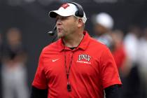 Head coach Barry Odom roams the field during the UNLV spring showcase game at Allegiant Stadium ...