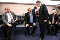 FILE - Phil Ruffin, center, visits with Nevada Gaming Commission member Steve Cohen before a NG ...