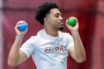 Former Alabama football quarterback Bryce Young warms up at Alabama's NFL pro day, Thursday, Ma ...