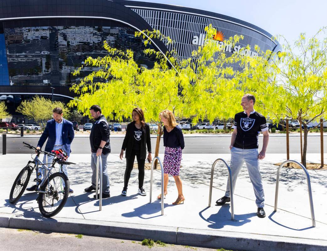 Clark County commissioner Michael Naft, left, Raiders President Sandra Douglass Morgan, center, ...