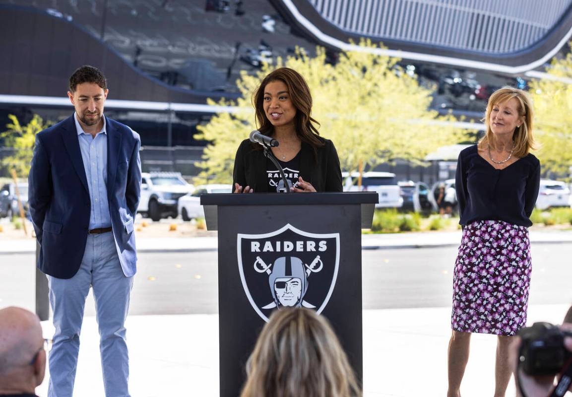 Raiders President Sandra Douglass Morgan, speaks, as Clark County commissioner Michael Naft, le ...