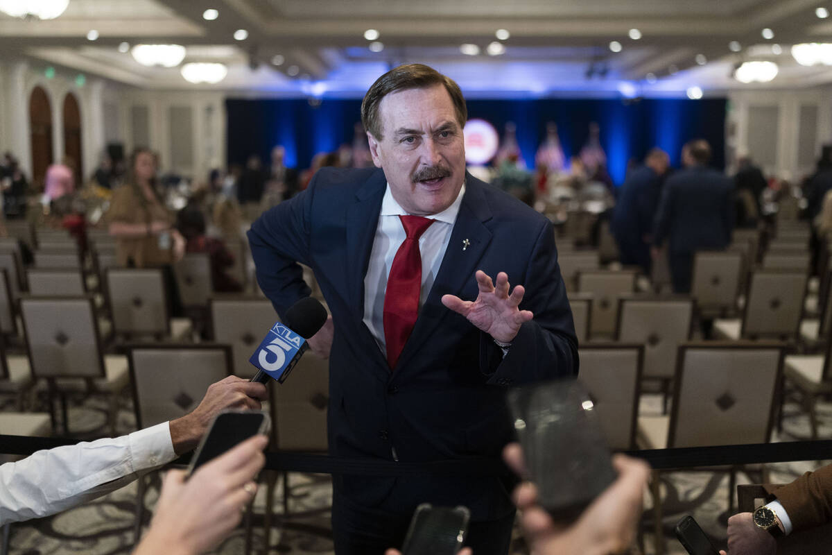 FILE - MyPillow chief executive Mike Lindell talks to reporters at the Republican National Comm ...