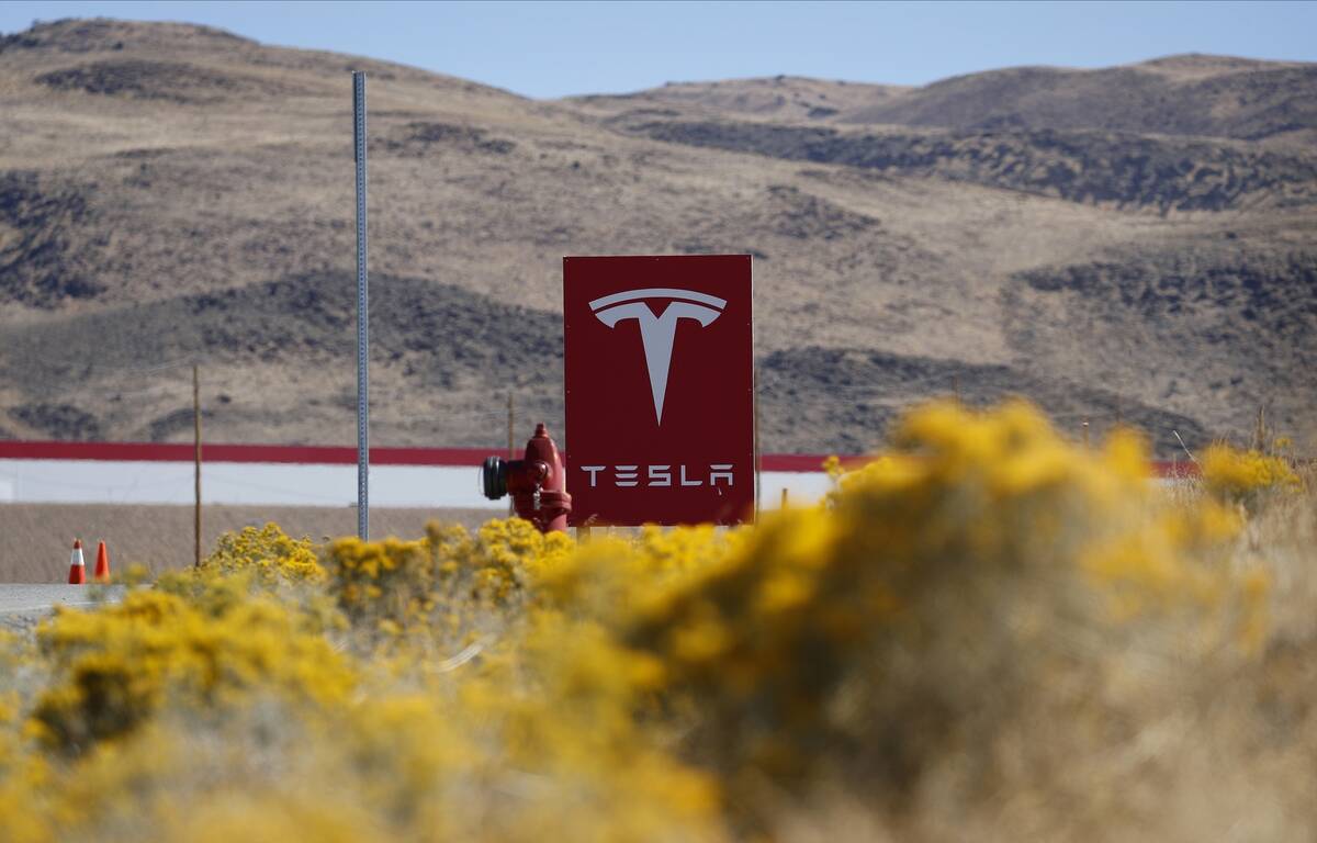 In this Oct. 13, 2018, file photo, a sign marks the entrance to the Tesla Gigafactory in Sparks ...