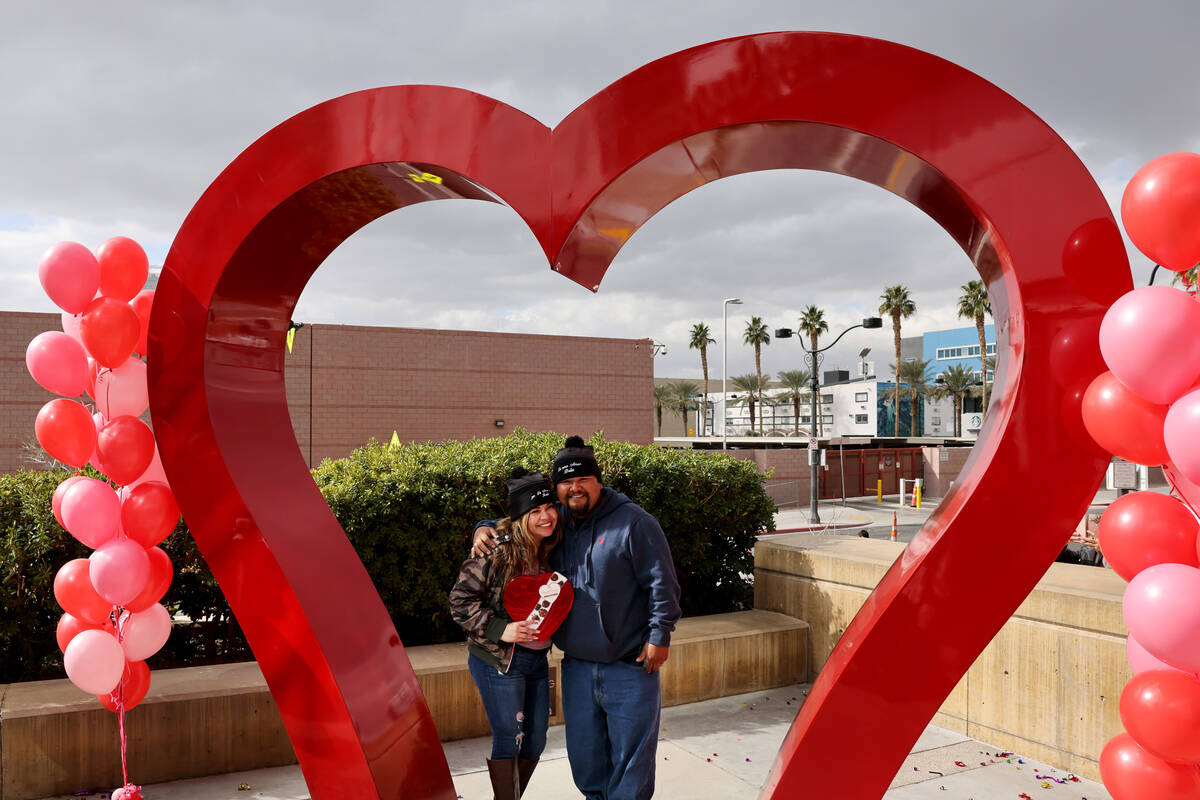 Wedding couple MarBella and Raul Moreno of San Diego are seen at the “Big Heart” sculpture ...