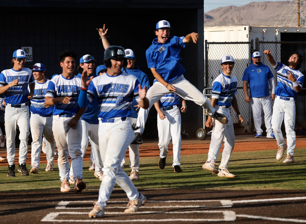 Basic players react after Basic’s Cooper Sheff (22) hit a grand slam home run during the sixt ...