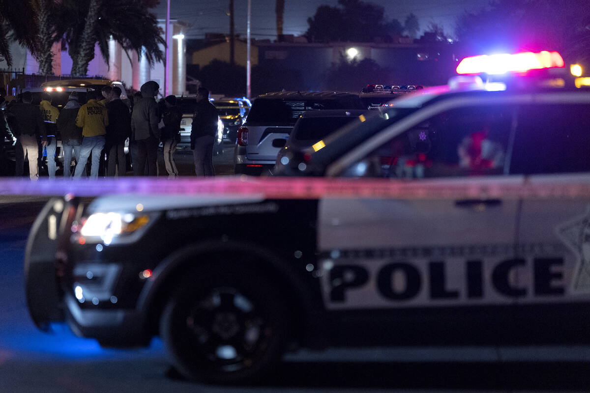 Metropolitan police investigate a homicide in the 3800 block of Royal Crest Street on Thursday, ...