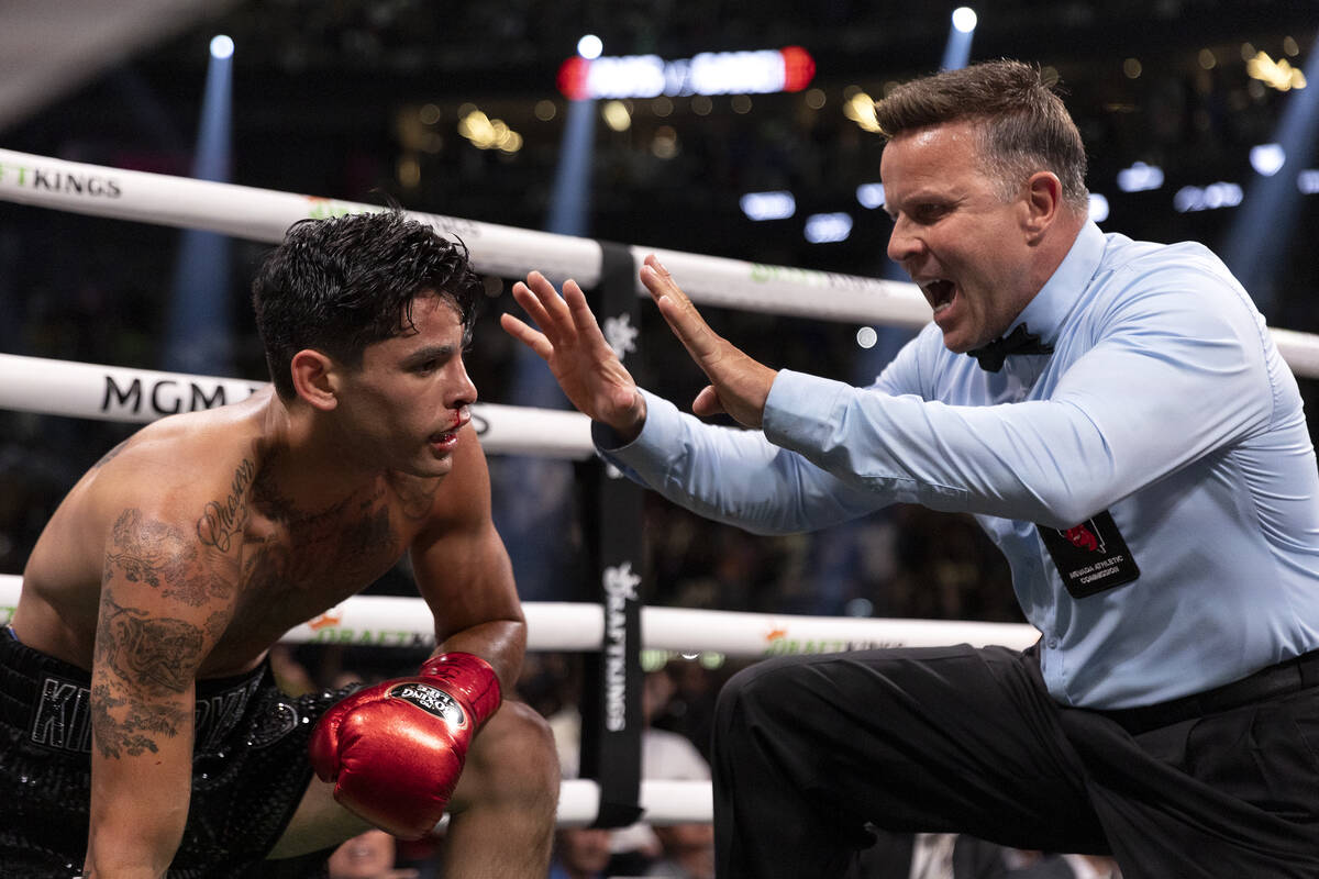 Referee Thomas Taylor calls a technical knock out on Ryan Garcia during a catchweight boxing bo ...