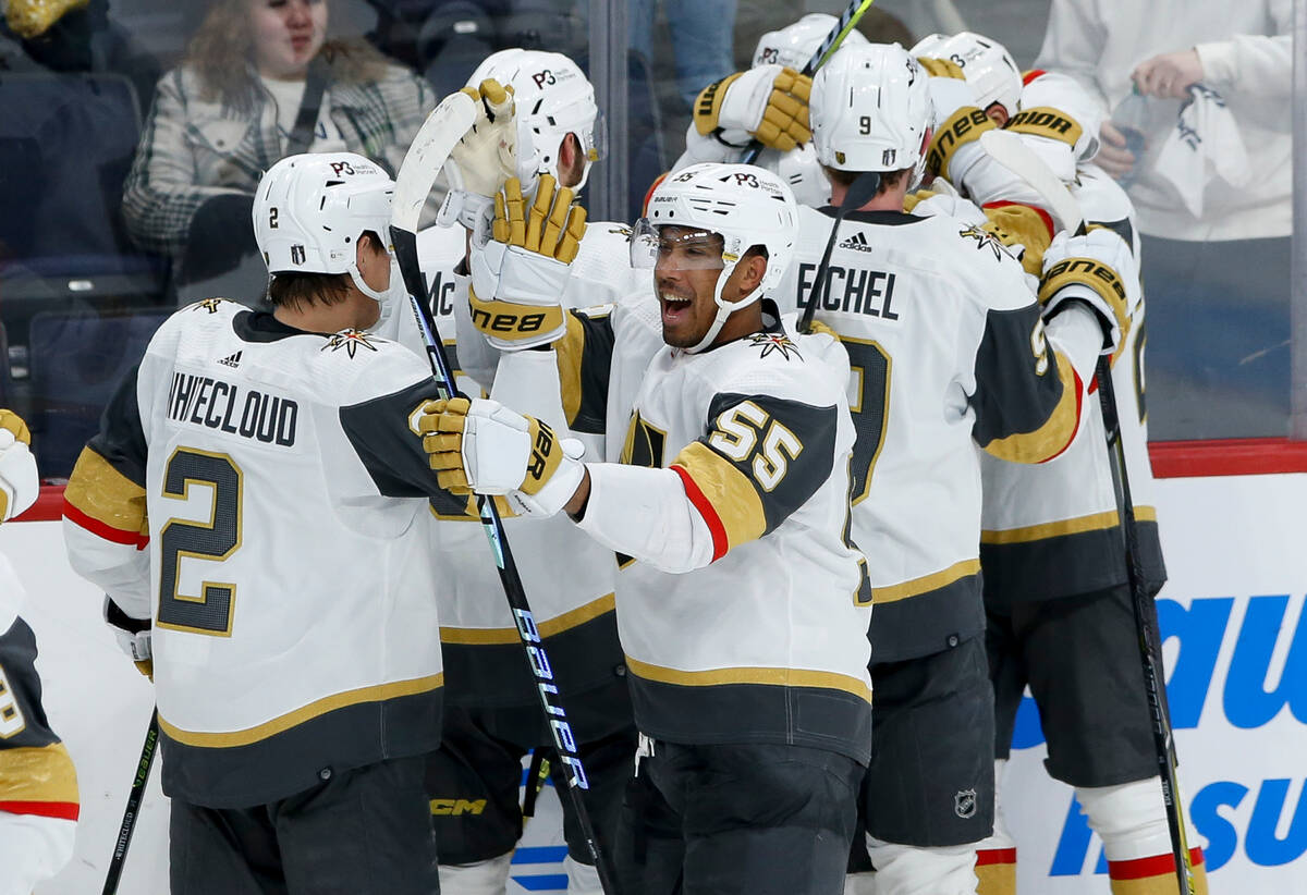 Vegas Golden Knights celebrate a win over the Winnipeg Jets in the second overtime in Game 3 of ...
