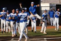 Basic players react after Basic’s Cooper Sheff (22) hits a grand slam home run during th ...
