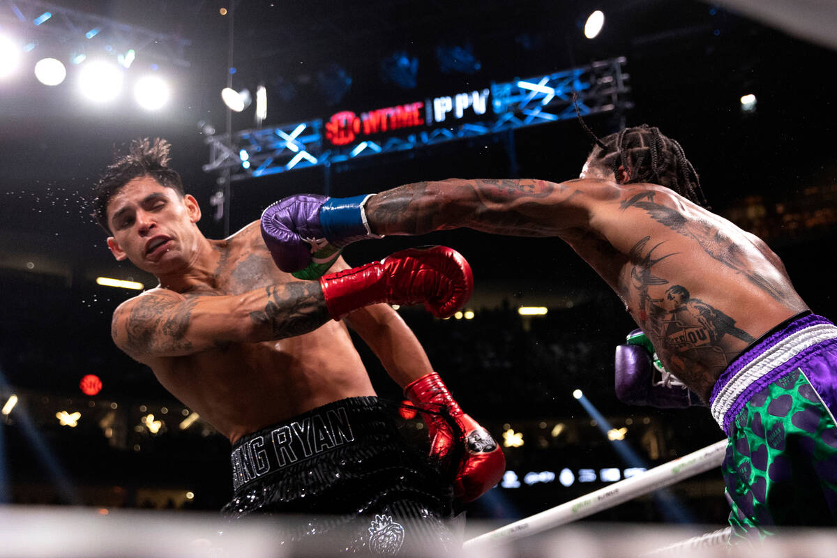 Gervonta Davis punches Ryan Garcia during a catchweight boxing bout at T-Mobile Arena on Saturd ...