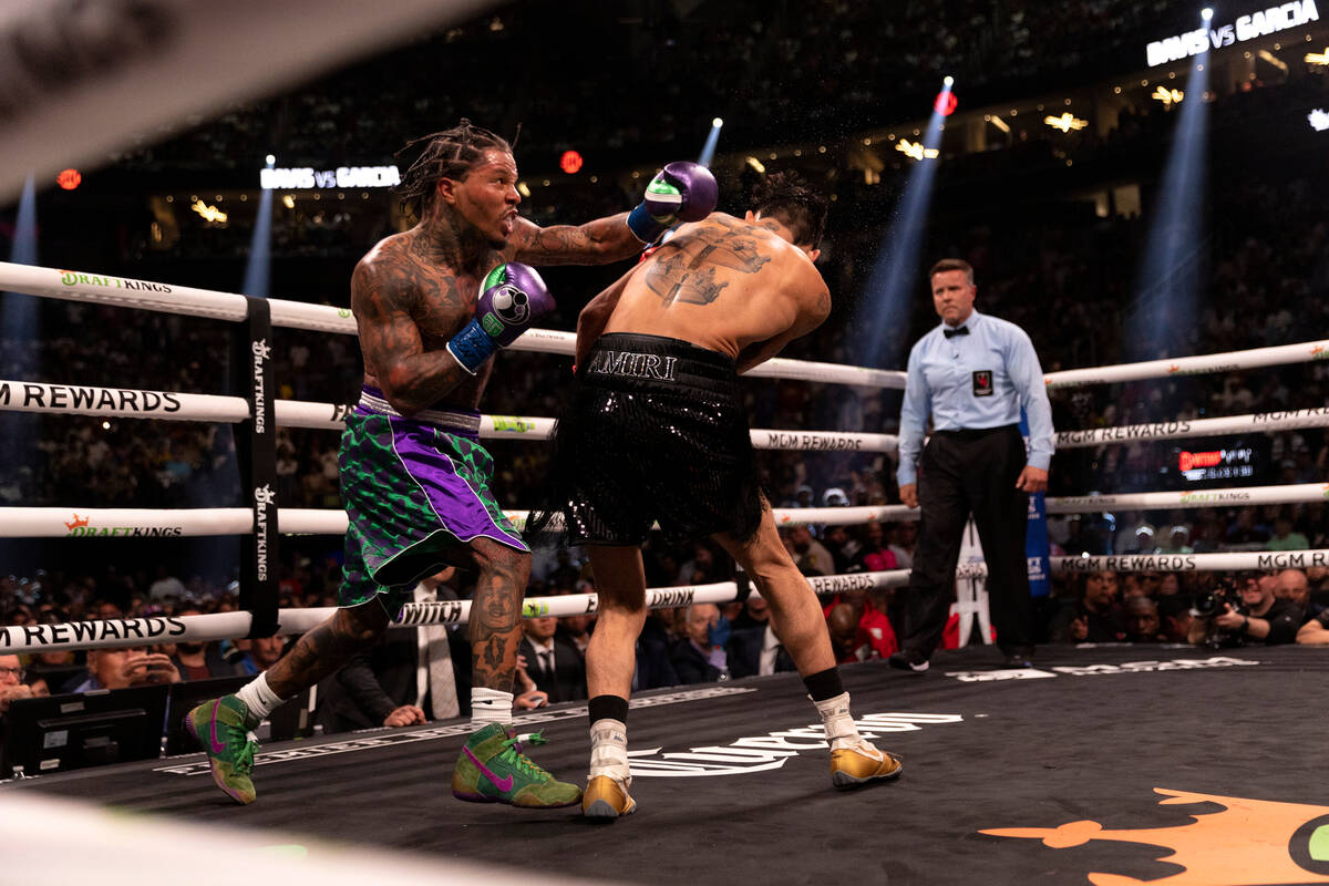 Gervonta Davis hits Ryan Garcia during a catchweight boxing bout at T-Mobile Arena on Saturday, ...