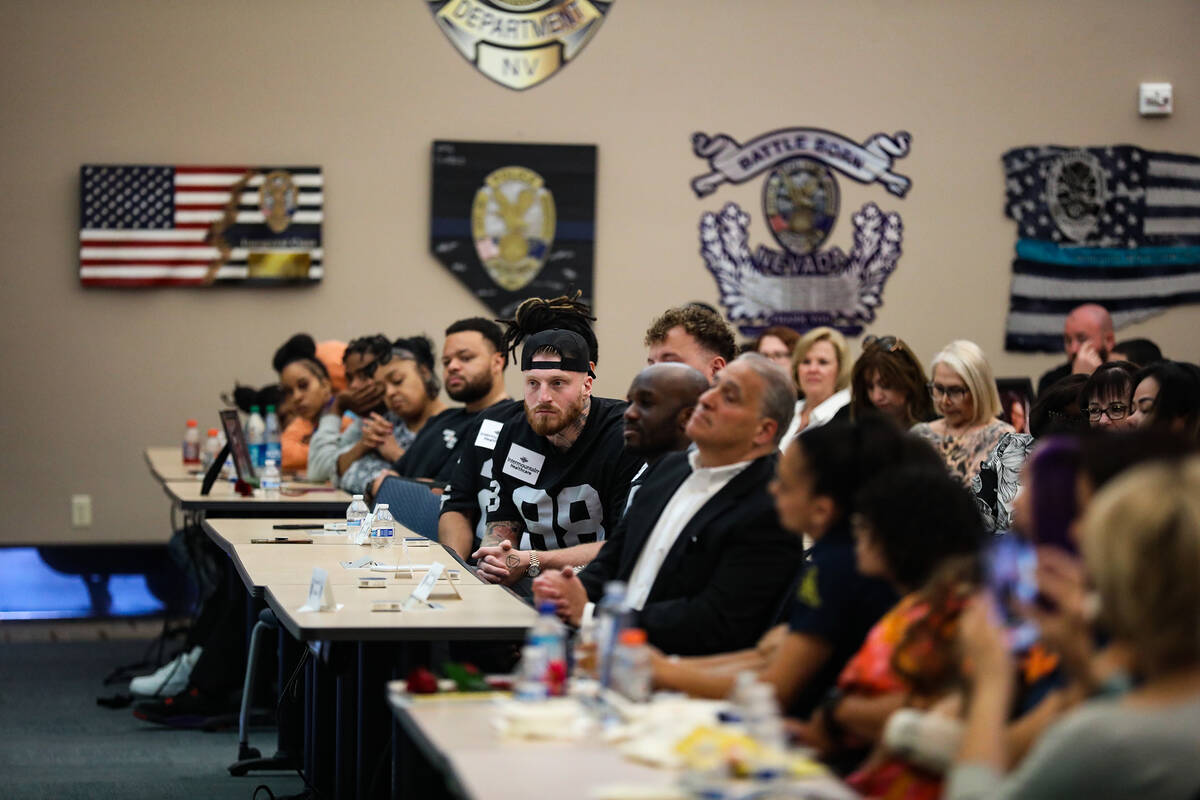 Raiders players and administration members at a “Heroes and Handcuffs” event to h ...