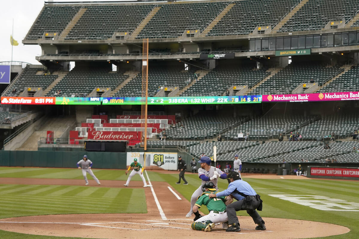 Texas Rangers' Kole Calhoun bats during a baseball game against the Oakland Athletics in Oaklan ...