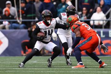 The Vegas Vipers' Cinque Sweeting runs against the Seattle Sea Dragons at Lumen Field on Sunday ...