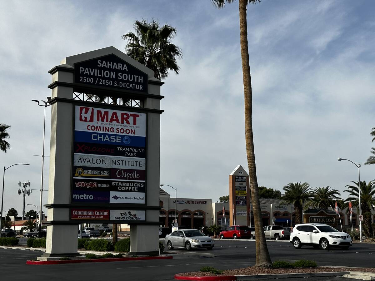 Exterior signs showing an H-Mart is set to open in Las Vegas near the intersection of Sahara Av ...
