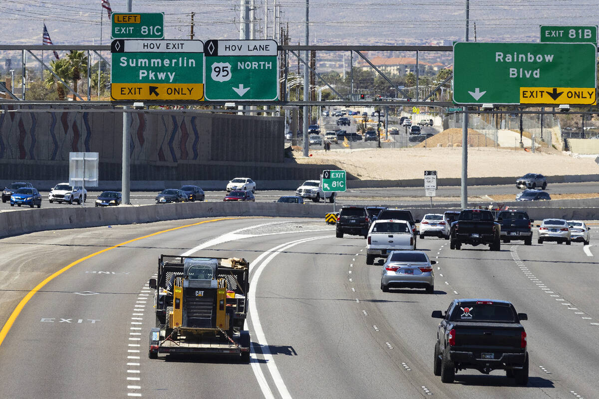 A carpool lane, left, is seen as motorist navigate on northbound Interstate 15, on Monday, Apri ...