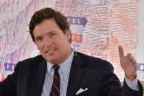 Political commentator Tucker Carlson participates in "A Ship of Fools: James Carville Interview ...