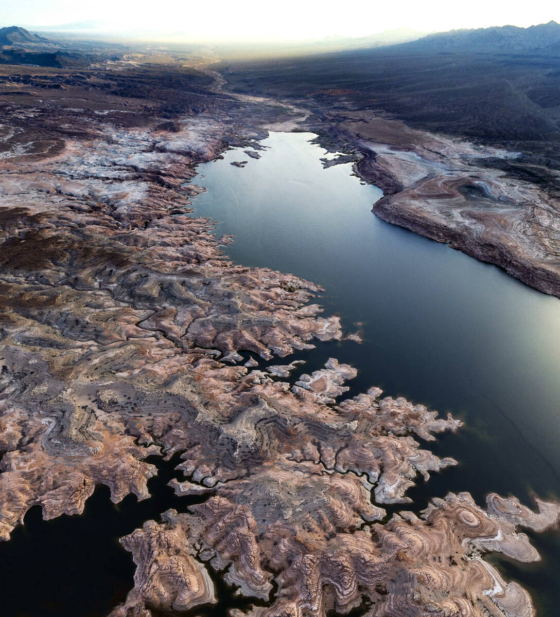 The receding Lake Mead shoreline late day creates an artistic pattern above the "Narrows&q ...