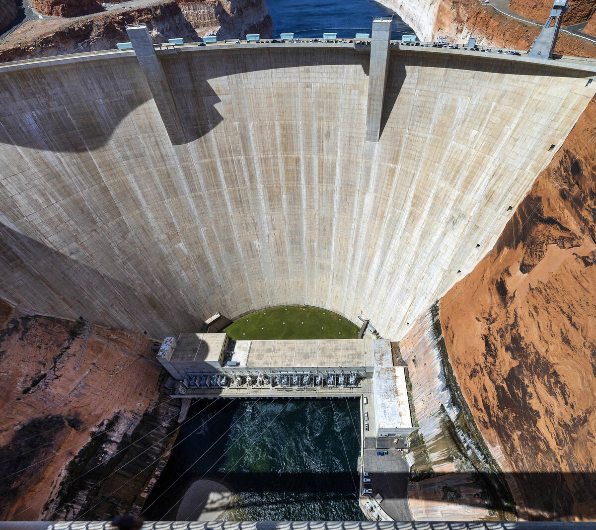 The Glen Canyon Dam with Colorado River flowing out below on Tuesday, April 18, 2023, in Page, ...