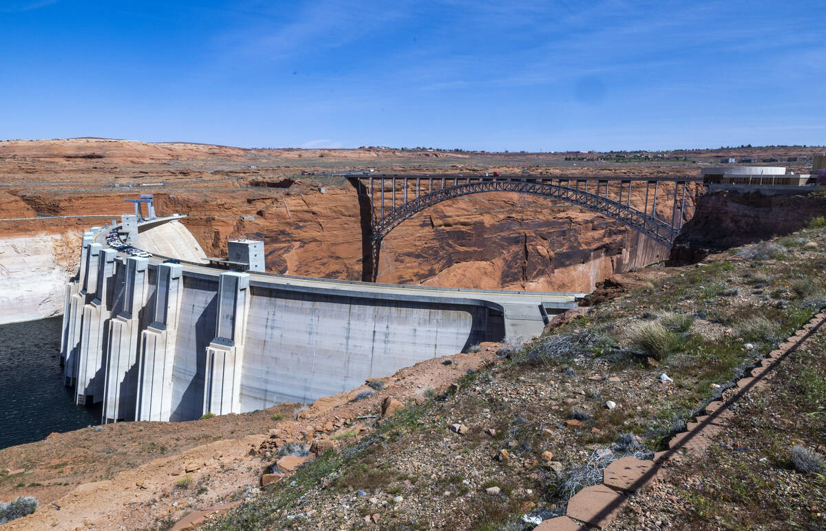 The Glen Canyon Dam with water flowing in from Lake Powell below on Tuesday, April 18, 2023, in ...